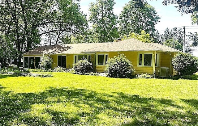 330 Chapin St, Ludlow, MA 01056 - rear view of property with central AC and a lawn
