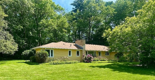 330 Chapin St, Ludlow, MA 01056 - view of front facade with a front lawn and a chimney