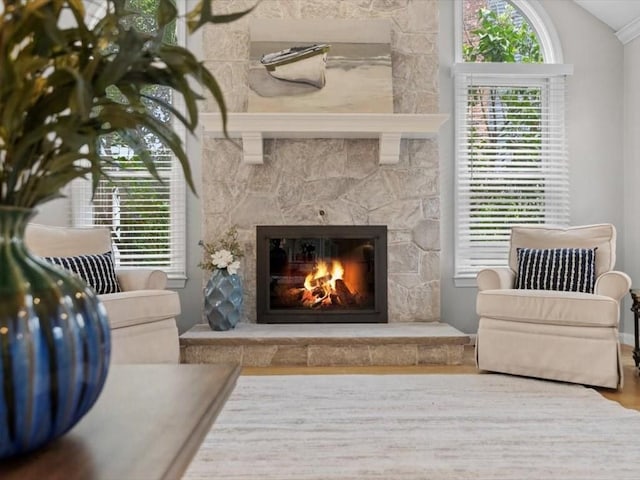 29 Shermans Way, Westwood, MA 02090 - living area with a fireplace, vaulted ceiling, and wood finished floors