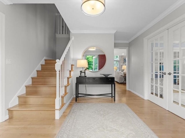 29 Shermans Way, Westwood, MA 02090 - staircase featuring wood finished floors, french doors, and crown molding