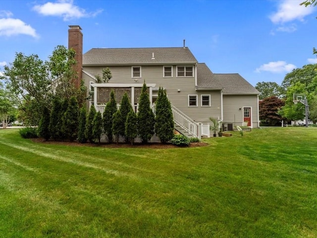 29 Shermans Way, Westwood, MA 02090 - back of house with a chimney and a yard