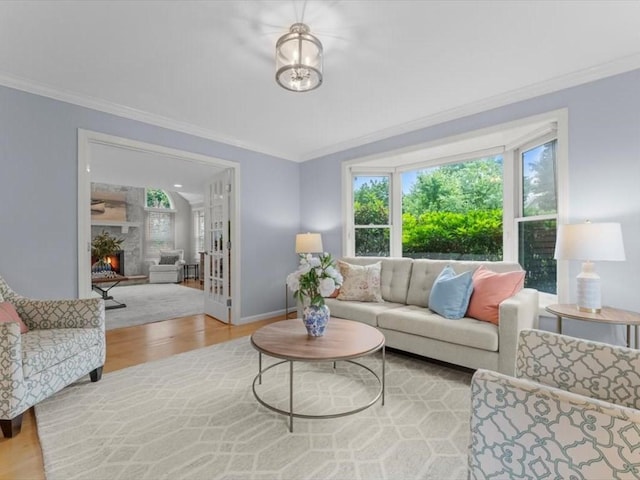 29 Shermans Way, Westwood, MA 02090 - living room with wood finished floors, ornamental molding, and a lit fireplace