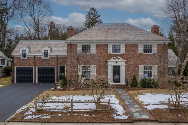 colonial home featuring a garage