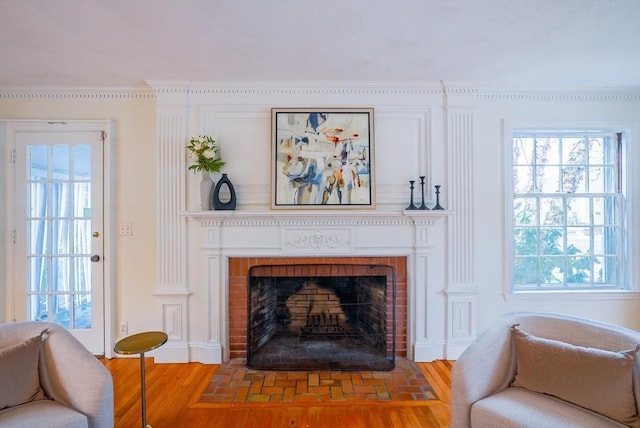 sitting room featuring hardwood / wood-style floors and a fireplace