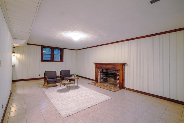 living area with light tile patterned flooring and a brick fireplace