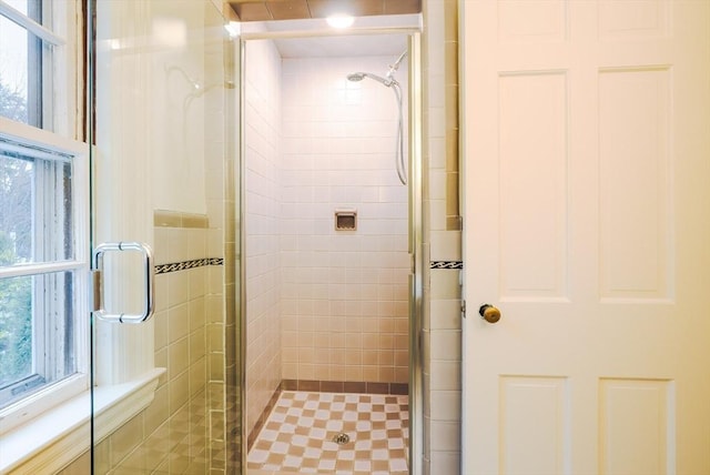 bathroom with a shower with shower door