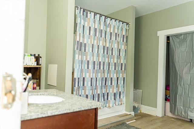 58-60 Virginia St, Springfield, MA 01108 - full bath featuring wood finished floors, a shower with shower curtain, and vanity