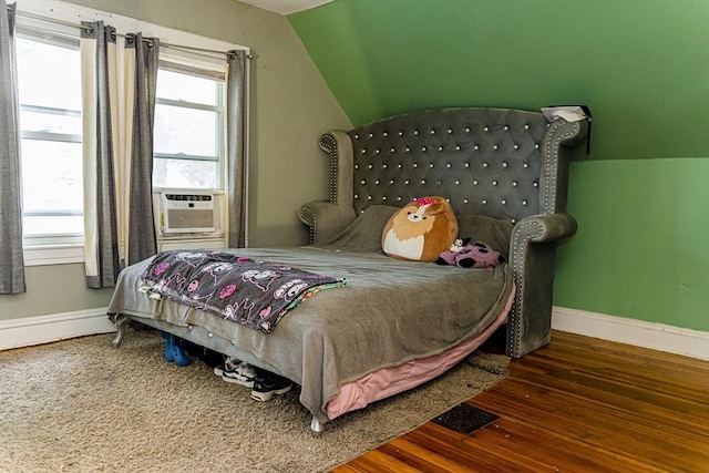 58-60 Virginia St, Springfield, MA 01108 - bedroom with baseboards, wood finished floors, vaulted ceiling, a baseboard radiator, and cooling unit