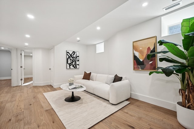 living room with light hardwood / wood-style flooring