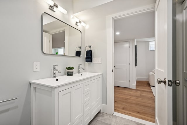 bathroom featuring vanity and wood-type flooring