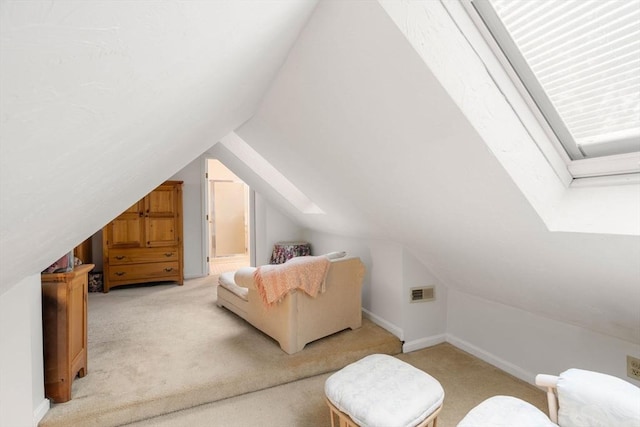 79 Brookdale Cir Unit 79, Shrewsbury, MA 01545 - bedroom with light colored carpet, lofted ceiling, baseboards, and ensuite bathroom