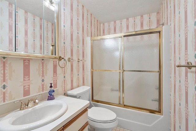 79 Brookdale Cir Unit 79, Shrewsbury, MA 01545 - full bathroom with wallpapered walls, toilet, vanity, and shower / bath combination with glass door