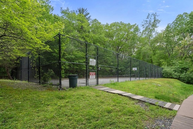 79 Brookdale Cir Unit 79, Shrewsbury, MA 01545 - view of tennis court featuring a gate and a view of trees