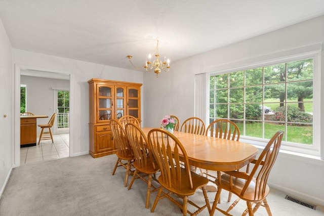 79 Brookdale Cir Unit 79, Shrewsbury, MA 01545 - dining space featuring a chandelier, baseboards, and light carpet