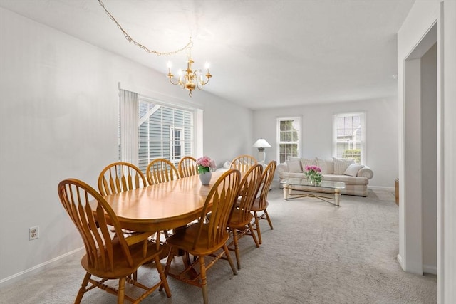 79 Brookdale Cir Unit 79, Shrewsbury, MA 01545 - dining area with a chandelier, light colored carpet, and baseboards