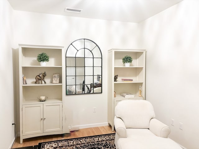 sitting room featuring light hardwood / wood-style floors