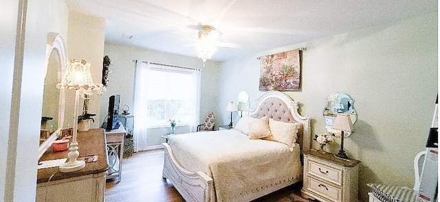 bedroom featuring wood-type flooring and ceiling fan