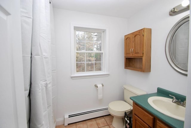 bathroom featuring tile patterned floors, baseboard heating, toilet, and vanity