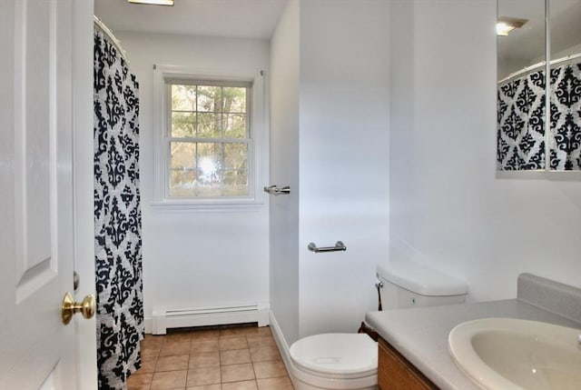 bathroom with vanity, baseboards, a baseboard heating unit, tile patterned floors, and toilet