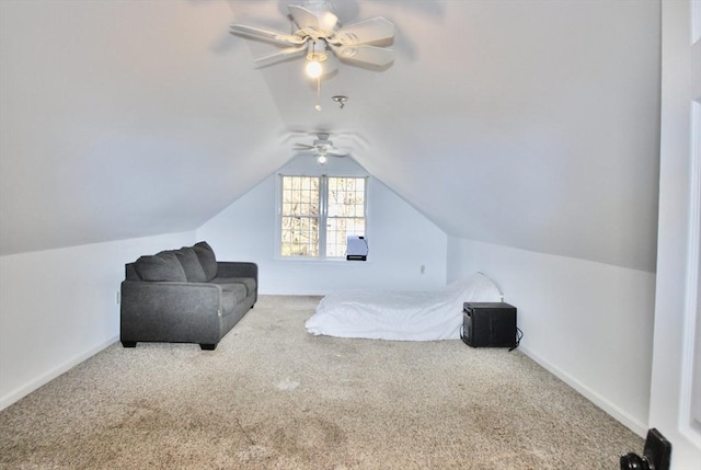 carpeted bedroom featuring baseboards, lofted ceiling, and ceiling fan