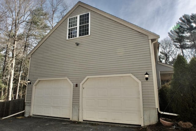 view of property exterior with fence