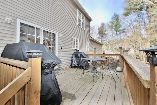 wooden terrace featuring grilling area