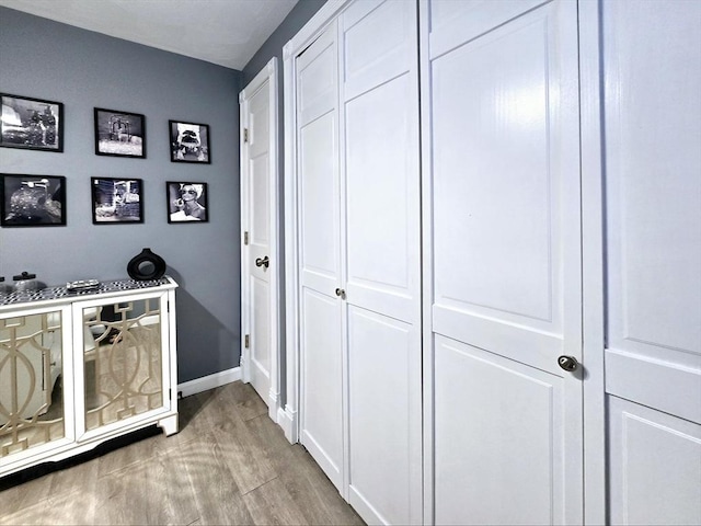 hallway featuring light hardwood / wood-style flooring