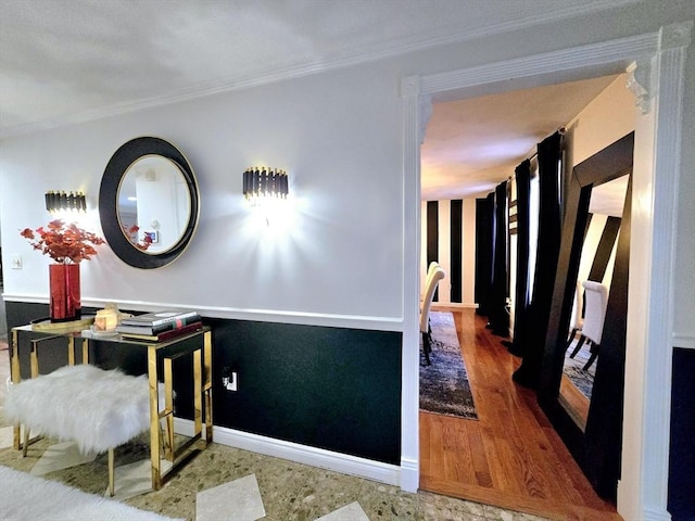 hallway with crown molding and wood-type flooring