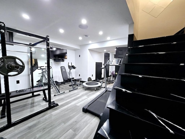 workout room featuring hardwood / wood-style floors