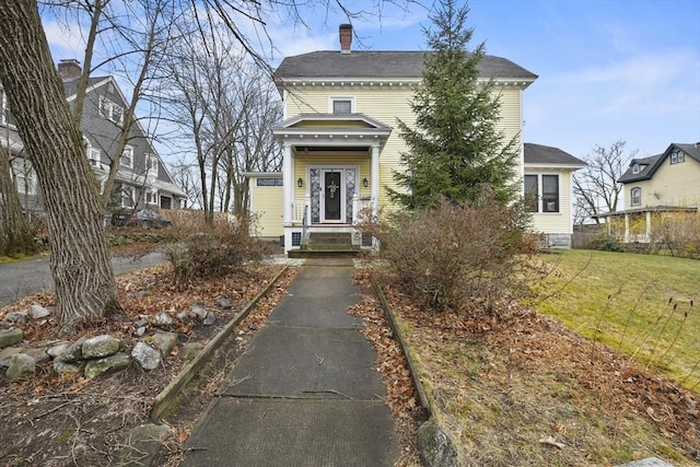 97 Livingston Ave, Lowell, MA 01851 - view of front of property featuring a front yard and a chimney