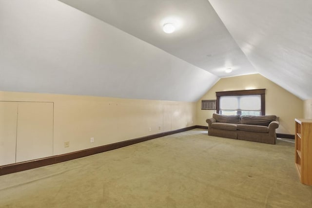 97 Livingston Ave, Lowell, MA 01851 - additional living space with light carpet, baseboards, and lofted ceiling