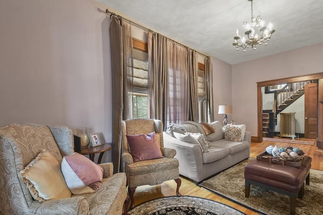 97 Livingston Ave, Lowell, MA 01851 - living area featuring stairs, an inviting chandelier, and wood finished floors