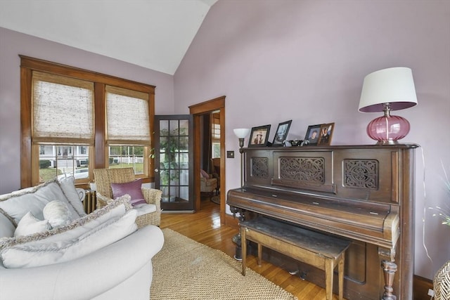 97 Livingston Ave, Lowell, MA 01851 - living area with high vaulted ceiling and wood finished floors