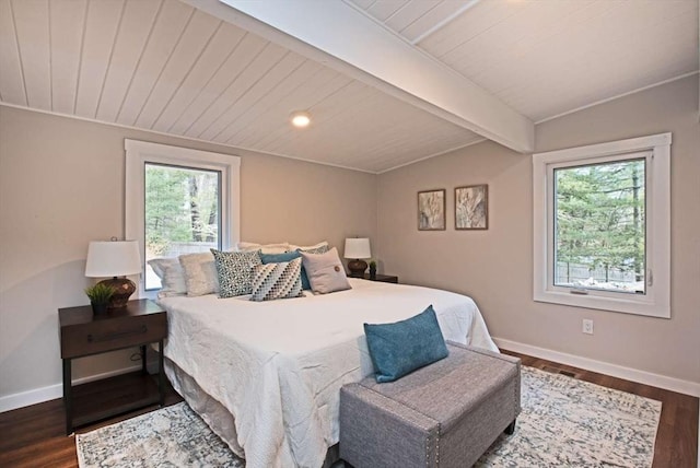 bedroom featuring vaulted ceiling with beams, multiple windows, and dark wood-style flooring