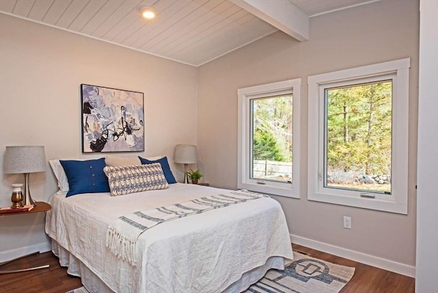 bedroom with dark wood-style floors, vaulted ceiling with beams, wood ceiling, and baseboards