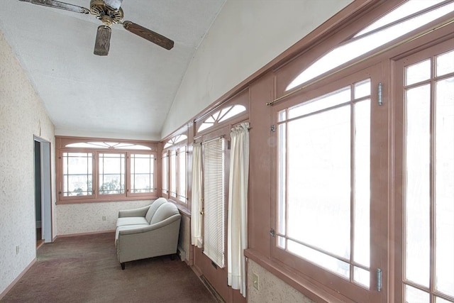 sunroom with lofted ceiling and ceiling fan