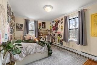 bedroom featuring a baseboard heating unit