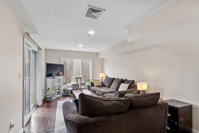 living room featuring dark hardwood / wood-style floors