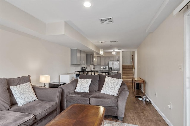 living room with dark hardwood / wood-style floors