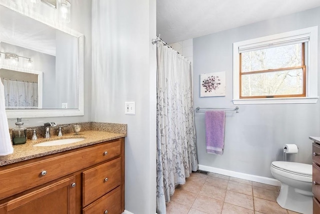 bathroom featuring vanity, tile patterned flooring, toilet, baseboards, and a shower with curtain