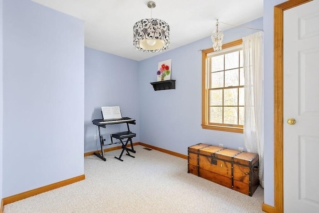 miscellaneous room with baseboards, visible vents, plenty of natural light, and carpet