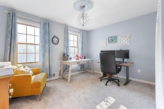 office space with baseboards, carpet, and visible vents