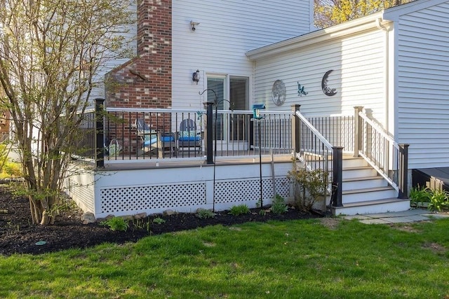 back of house with a lawn and a deck