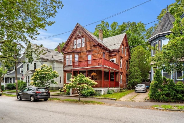 12 Summit Ave Unit 1, Salem, MA 01970 - view of front of property with a chimney, a porch, a balcony, and a shingled roof