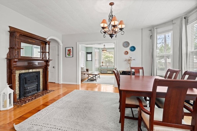 12 Summit Ave Unit 1, Salem, MA 01970 - dining area featuring plenty of natural light, light wood-style flooring, a chandelier, and a fireplace