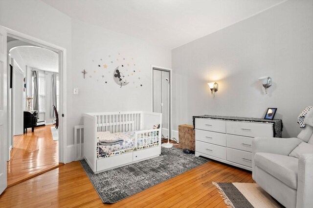 12 Summit Ave Unit 1, Salem, MA 01970 - bedroom with light wood-style flooring and arched walkways