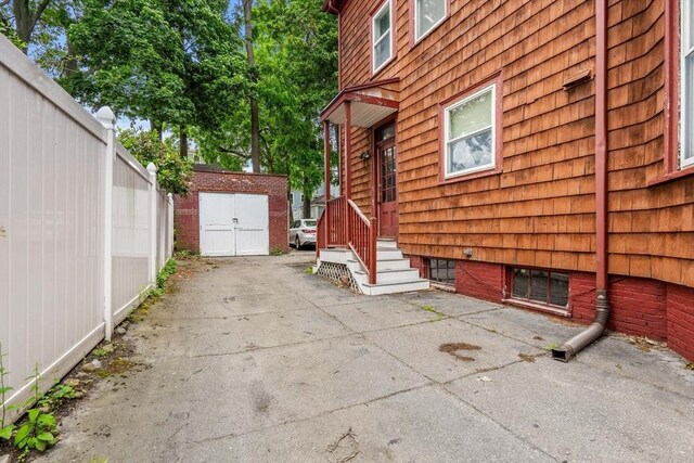 12 Summit Ave Unit 1, Salem, MA 01970 - view of home's exterior featuring a storage unit and a patio