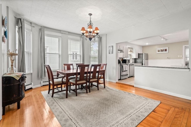 12 Summit Ave Unit 1, Salem, MA 01970 - dining room with a chandelier, baseboard heating, and light wood-type flooring