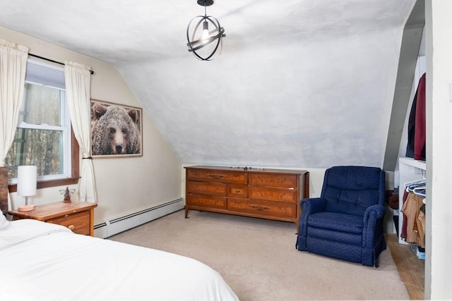 bedroom with lofted ceiling, carpet, and a baseboard radiator