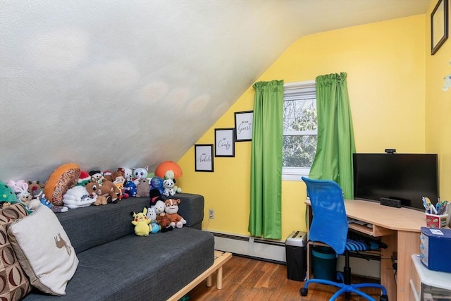 bedroom with a baseboard radiator, lofted ceiling, and wood finished floors